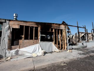 Restoration team cleaning smoke and soot damage after a fire in a Granada Hills home.